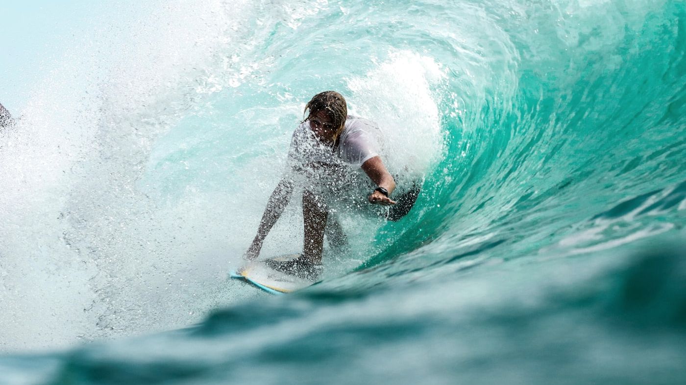 Surfer inside a breaking wave